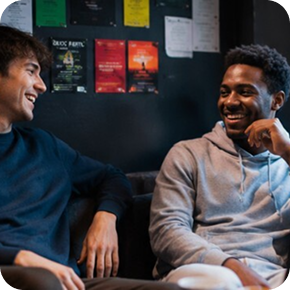 A Close Friend: Two university friends talking in a student bar